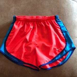 Blue and pink nike women’s running shorts